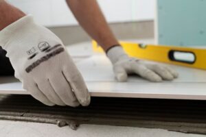 A worker's hands in a fixer upper home